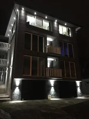 a building at night with lights on at Apartment Ajla in Tuzla