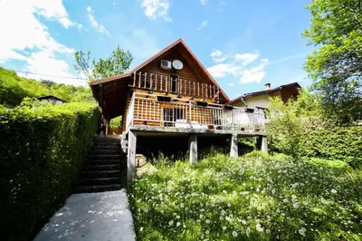 a house with a staircase leading to it at Apartman Relax in Nature in Jajce