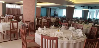 a banquet hall with white tables and chairs at Hotel Novitas Livno in Livno