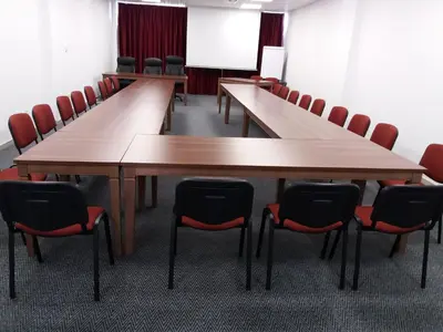 a conference room with wooden tables and chairs at Hotel Novitas Livno in Livno