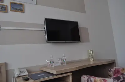 a flat screen tv hanging on a wall at Hotel Novitas Livno in Livno