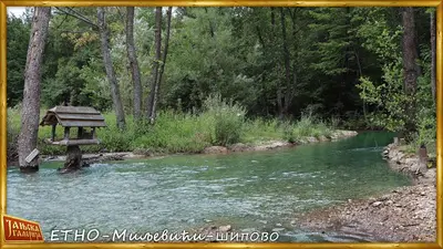 a picnic table sitting in the middle of a river at Etno kuce Miljevic in Šipovo