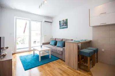 a living room with a couch and a table at Jelena Apartment in Doboj