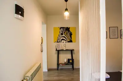 a hallway with a zebra painting on the wall at Apartment Fortuna in Visoko