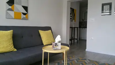 a living room with a couch and a table at Apartment Fortuna in Visoko