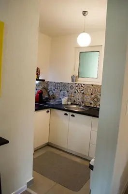 a kitchen with a sink and a counter top at Apartment Fortuna in Visoko