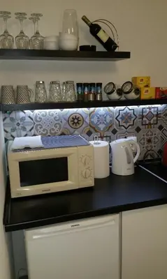 a microwave sitting on a counter in a kitchen at Apartment Fortuna in Visoko