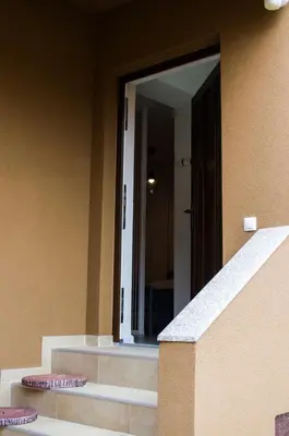 a mirror on the side of a building with stairs at Apartment Fortuna in Visoko