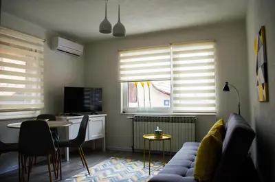 a living room with a couch and a table at Apartment Fortuna in Visoko