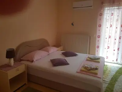 a bedroom with a bed with two pillows on it at Guesthouse 