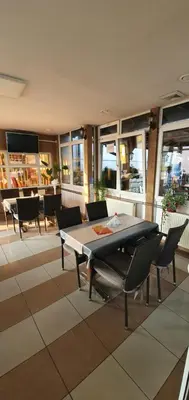 a dining room with a table and chairs at Guesthouse 