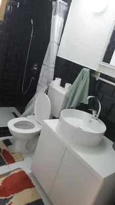 a bathroom with a toilet and a sink in it at Holidayhouse Visoko in Visoko
