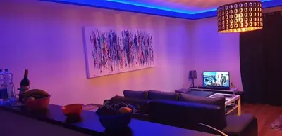 a living room with purple lighting and a couch at Holidayhouse Visoko in Visoko