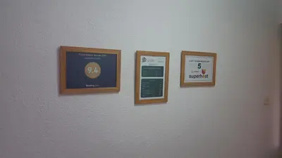 four pictures hanging on a wall in a room at Apartment Sajra in Kulen Vakuf