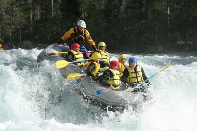 a group of people in a raft on a river at Apartment Sajra in Kulen Vakuf