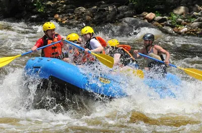 a group of people in a raft in a river at Apartment Sajra in Kulen Vakuf