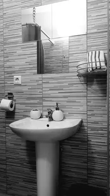 a bathroom with a white sink and a mirror at Apartment Sajra in Kulen Vakuf