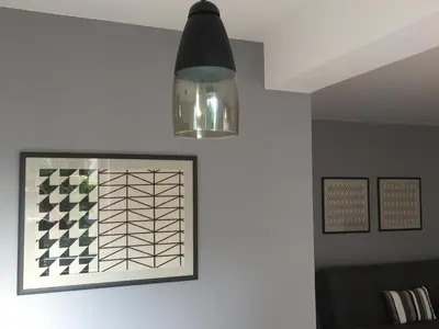a light hanging above a picture on a wall at Apartment Adi in Travnik