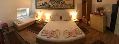 a bedroom with a large white bed in a room at Prenoćište Gany in Jajce