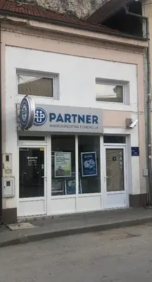 a store front with a patorher sign on the front at Prenoćište Gany in Jajce