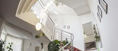 a staircase in a house with plants at Hotel Senad od Bosne in Prokosovići