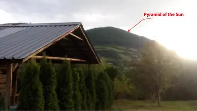 a barn with a pole on top of a mountain at Piramida Mjeseca in Visoko