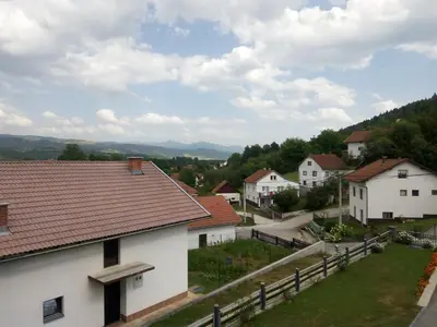 a view of a village with houses and a fence at Holiday Home Nana in Bugojno