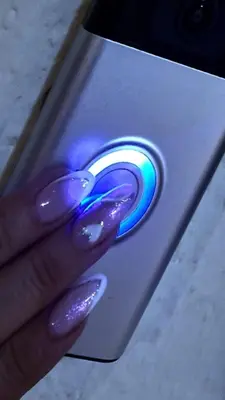 a hand is holding a phone with an apple symbol on it at Apartment Sekulic in Doboj