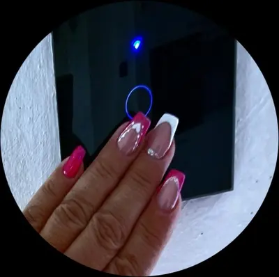 a hand with pink nails holding a key chain at Apartment Sekulic in Doboj