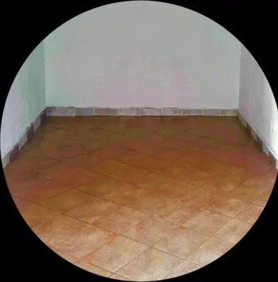 an empty room with a tile floor and a wall at Apartment Sekulic in Doboj