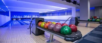 a bowling alley with a bunch of bowling balls at AMAI Exclusive in Tuzla