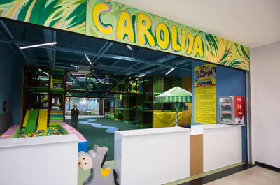 a childrens play area in a building with a playground at AMAI Exclusive in Tuzla
