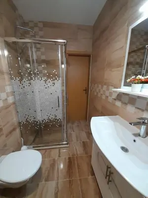 a bathroom with a shower and a toilet and a sink at Kuća za odmor Panorama Lohovo Bihać in Bihać