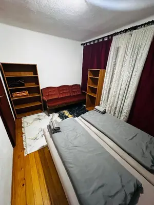 a small bedroom with a bed and a window at Rooms Cobras II in Jajce