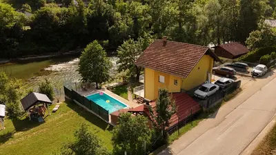 an aerial view of a house with a swimming pool at Holiday Homer Vila na Obali Vrbasa in Banja Luka