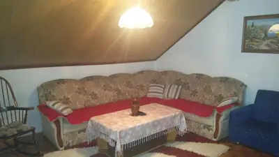 a living room with a couch and a table at Apartman Ela in Bihać
