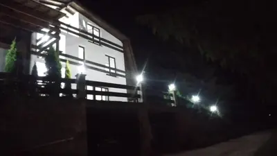 a building at night with lights on it at Apartments Žera in Vlasic