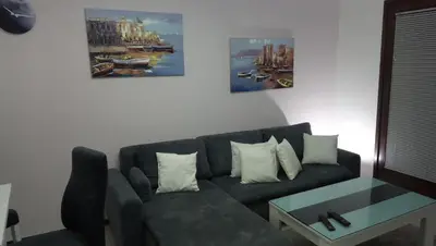 a living room with a couch and a table at Apartments Žera in Vlasic