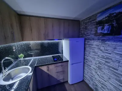 a kitchen with a sink and a white refrigerator at Jajce,Plivsko jezero in Jajce