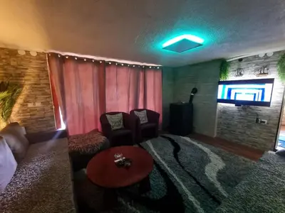 a living room with a couch and a television at Jajce,Plivsko jezero in Jajce
