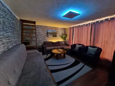a living room with a couch and a table at Jajce,Plivsko jezero in Jajce