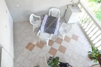 an overhead view of a table and chairs in a house at Prenociste Orhideja in Odžak