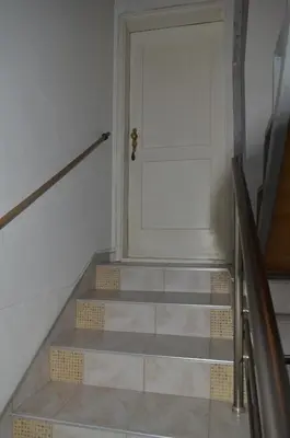 a set of stairs leading to a door at Prenociste Orhideja in Odžak