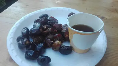 a plate with a cup of coffee and a plate of food at Apartments BellaMonte Vlašić in Vlasic