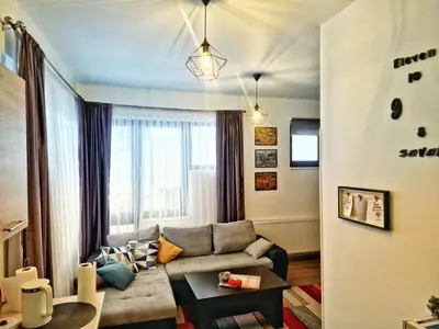 a living room with a couch and a table at Downtown Apartment Travnik in Travnik