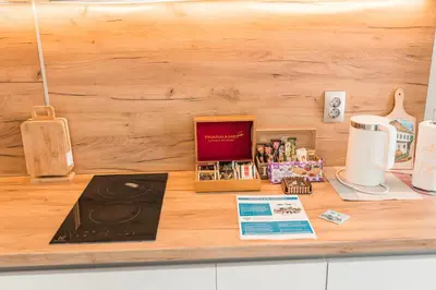 a kitchen counter with a counter top with items on it at Downtown Apartment Travnik in Travnik