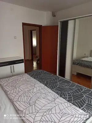 a large bed in a room with a large bed sidx sidx at Apartman Mima in Banja Luka