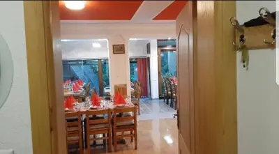 a dining room with a table with red flags on it at Villa Tiha noc in Vlasic