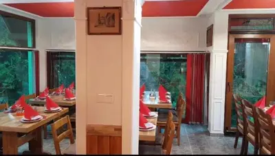 a dining room with wooden tables with red hats on them at Villa Tiha noc in Vlasic