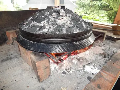 a pile of coal sitting on top of a stove at Smreka Vlašić in Vlasic